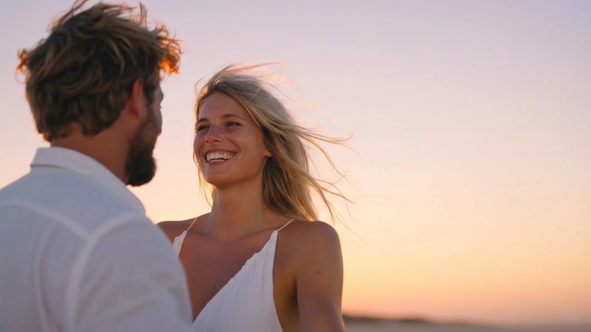 Bride laughing with groom during a sunset Cyprus destination wedding, captured in natural light by Soomore